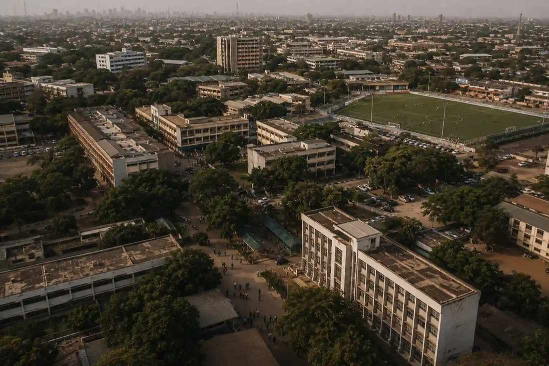 Aerial view of West African university campus with football training in progress